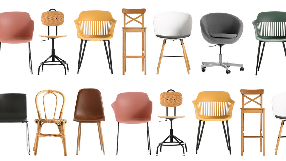 A variety of chairs in different styles, colors, and materials arranged in two rows.