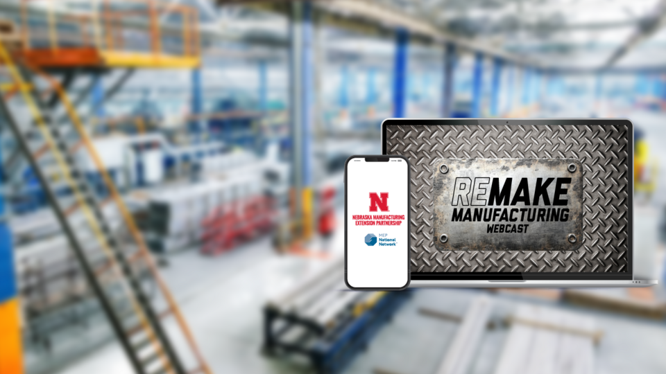 Remake manufacturing title on metal plate displaying on laptop in front of factory interior