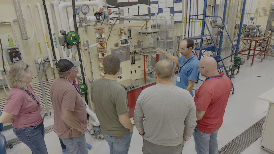 Dr. Hunter Flodman leading PCE demonstration to participants in pilot plant